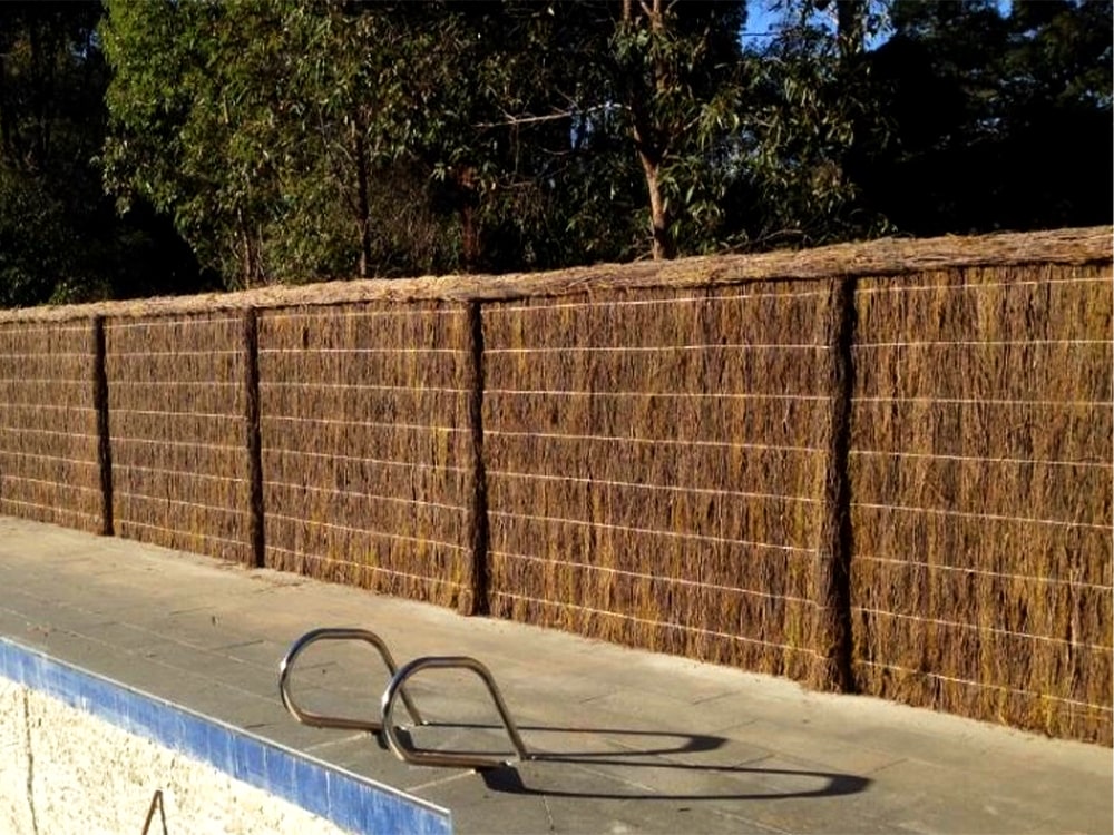 Brushwood Fence surrounding a pool