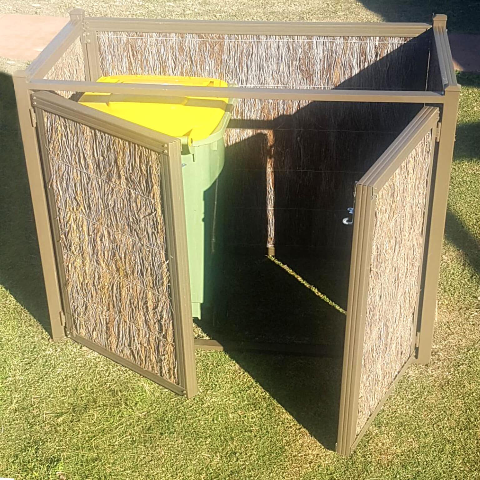 Neat and sturdy brushwood bin enclosure with the door open showing the bins